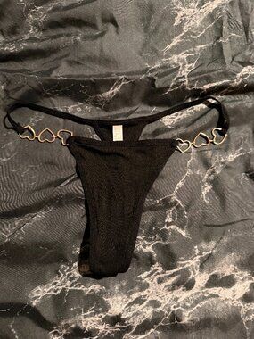 Stylish and chic metal decorated thong, size M